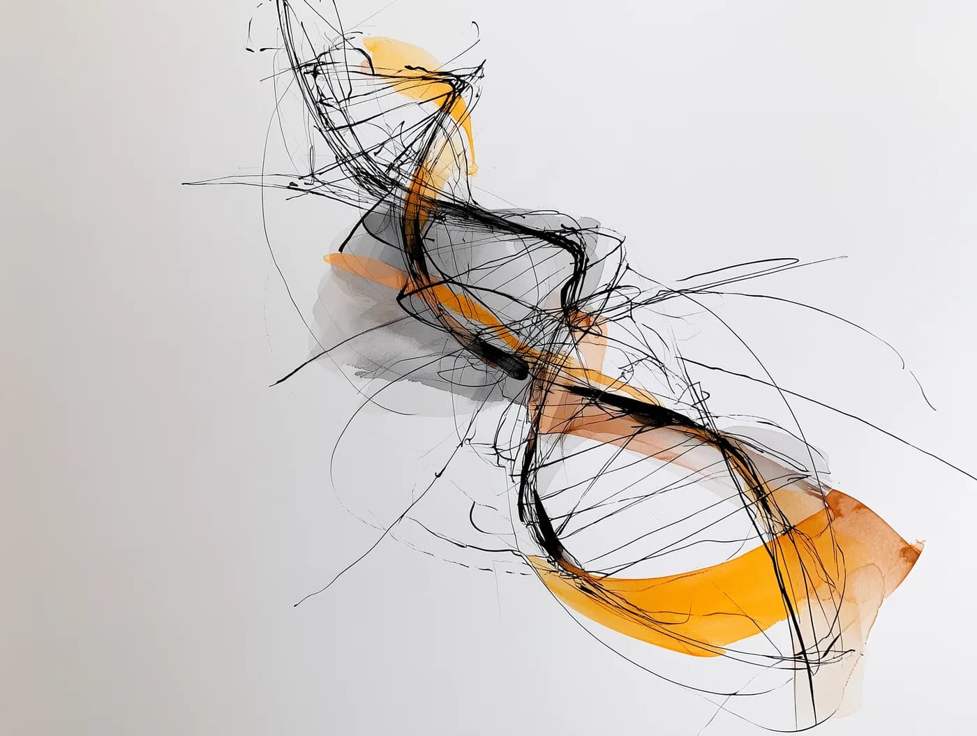 Charcoal and ochre sketch of a spiral form turning inward and outward.